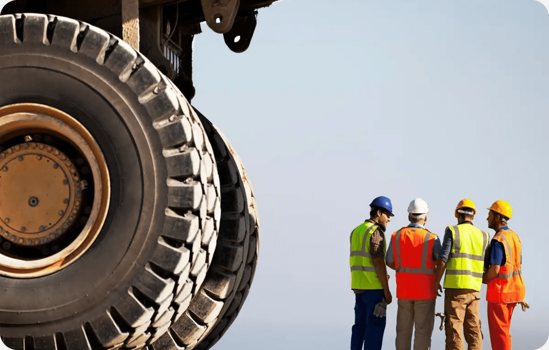 Industrial workers in safety gear at a remote operations site