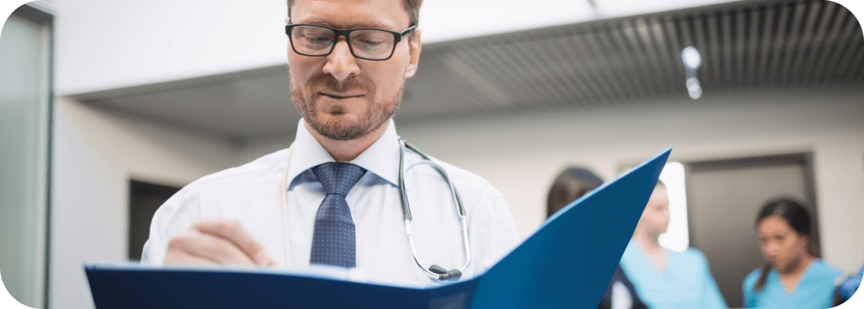 Physician reviewing clinical requirements for a global placement