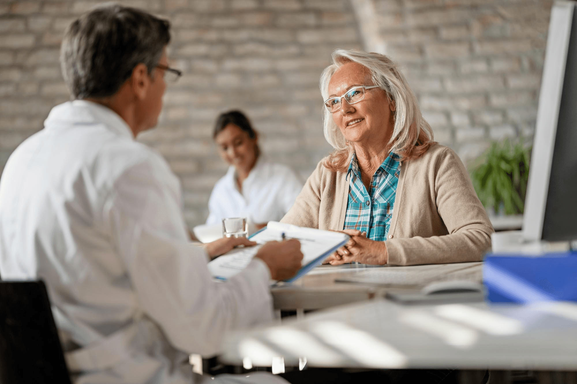 Physician consulting with a patient
