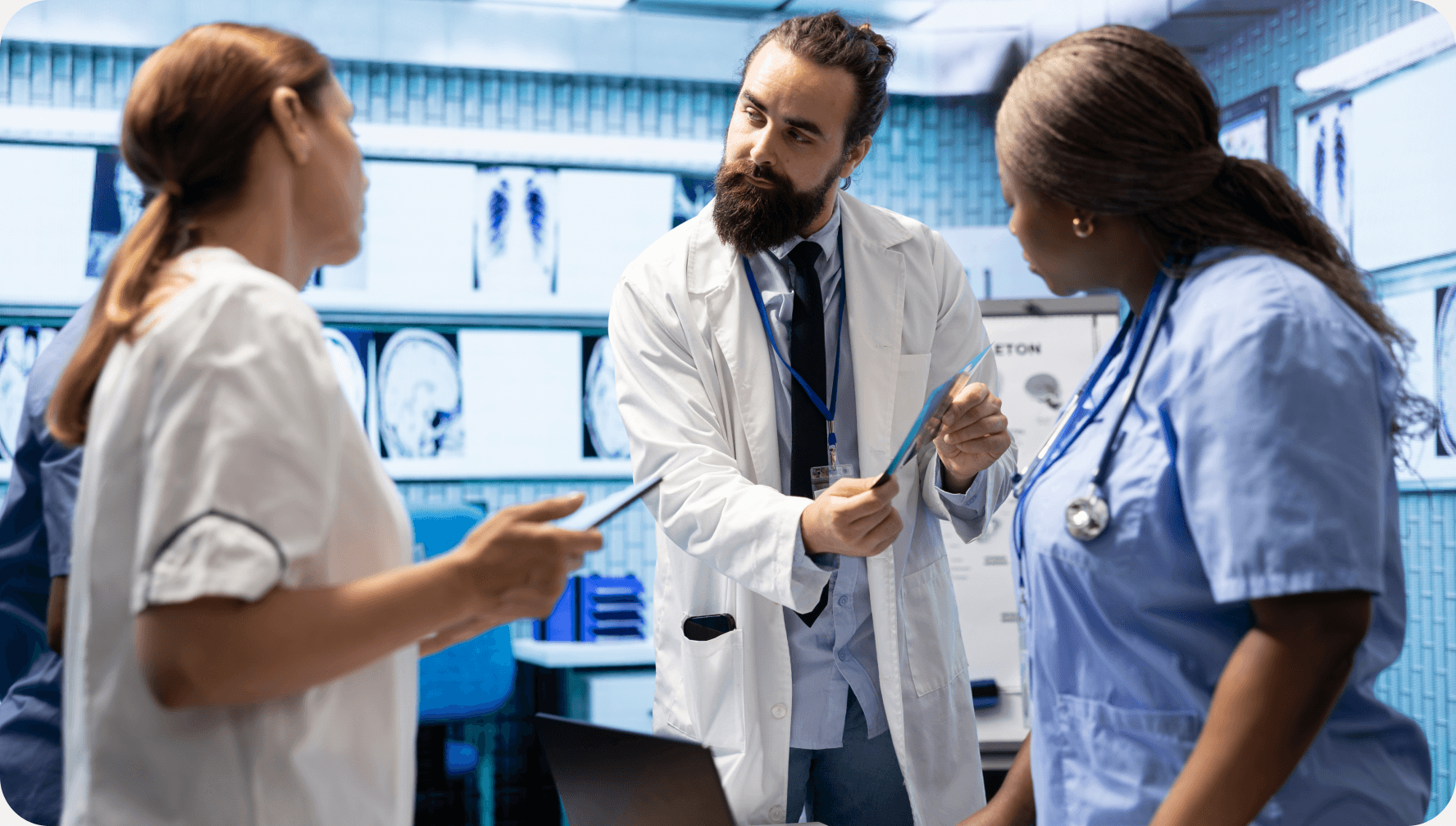 Clinical team reviewing medical imaging in a modern care setting