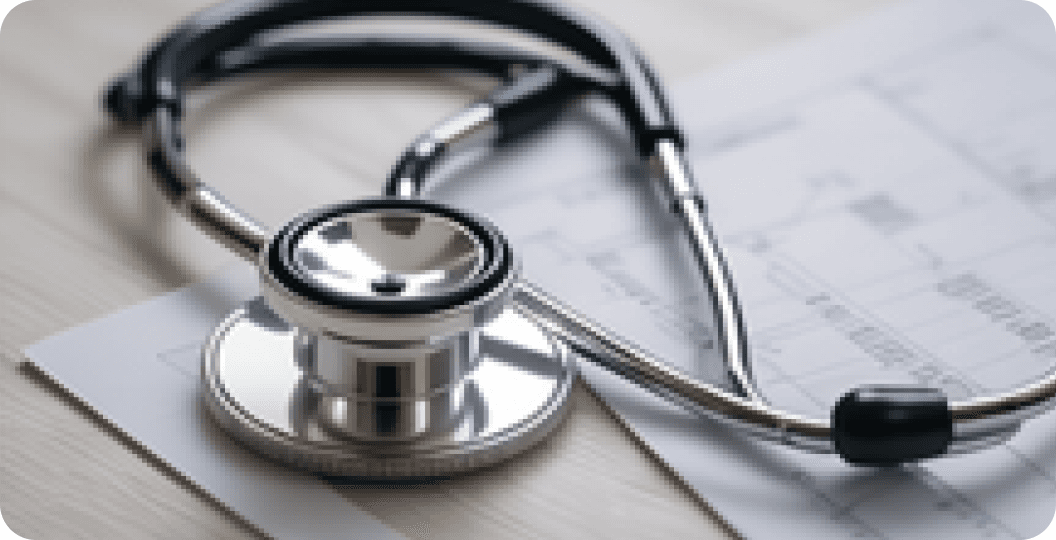 Stethoscope resting on medical documents
