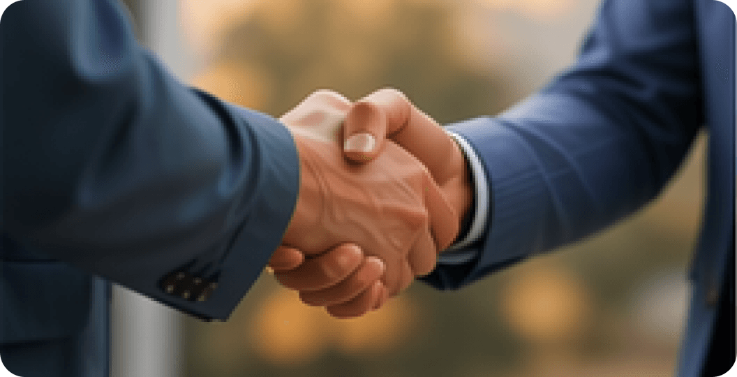 Two professionals shaking hands in agreement